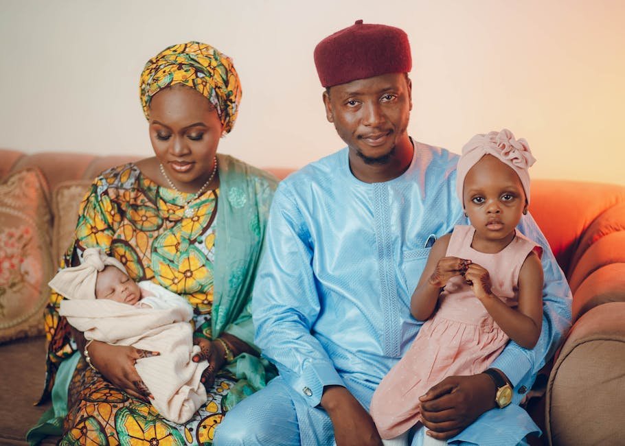 A loving Nigerian family in traditional attire, celebrating culture and unity.