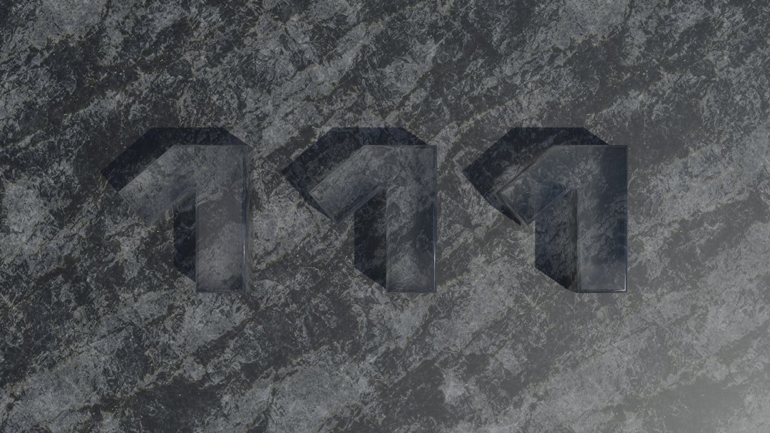 A close up of the letters p and p on a stone surface